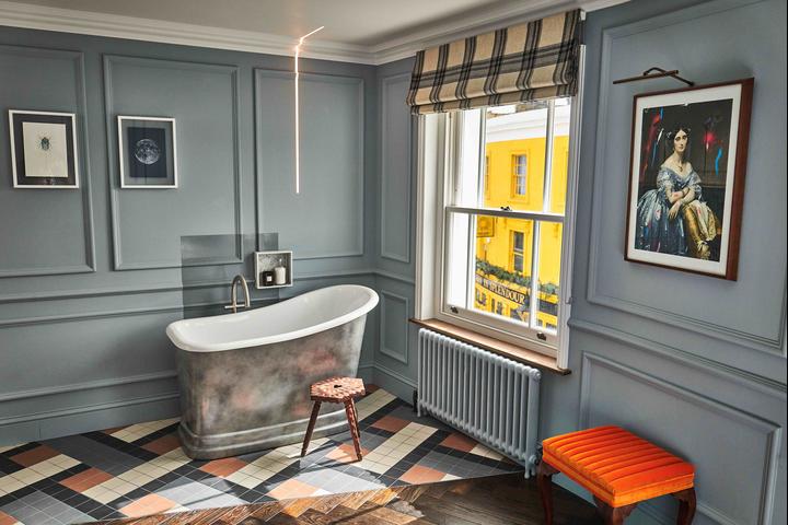 A cute bathtub sits in The Muse suite at The Lost Poet, London